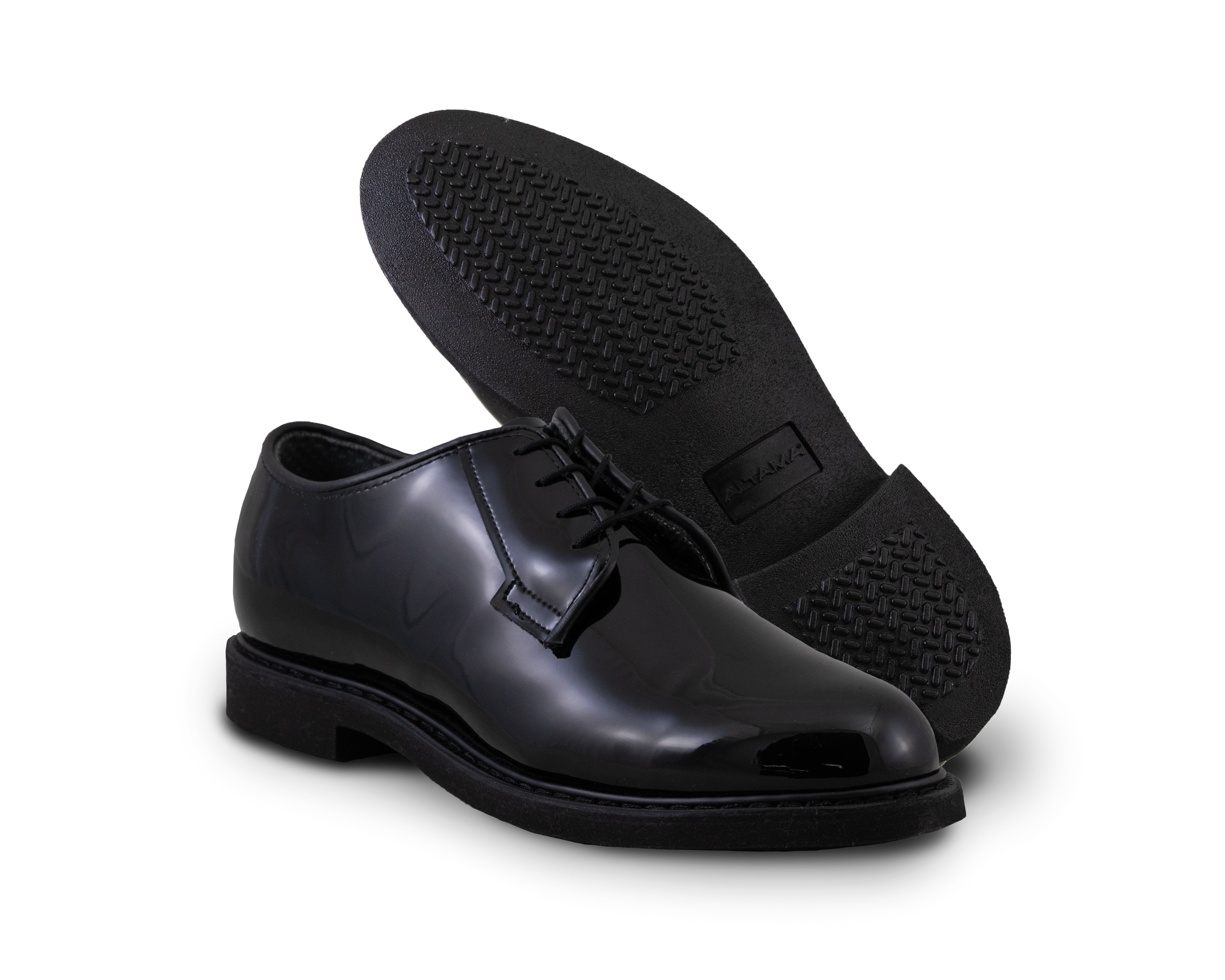 2 black gloss leather shoes sit beside each other showing sole and top of shoe